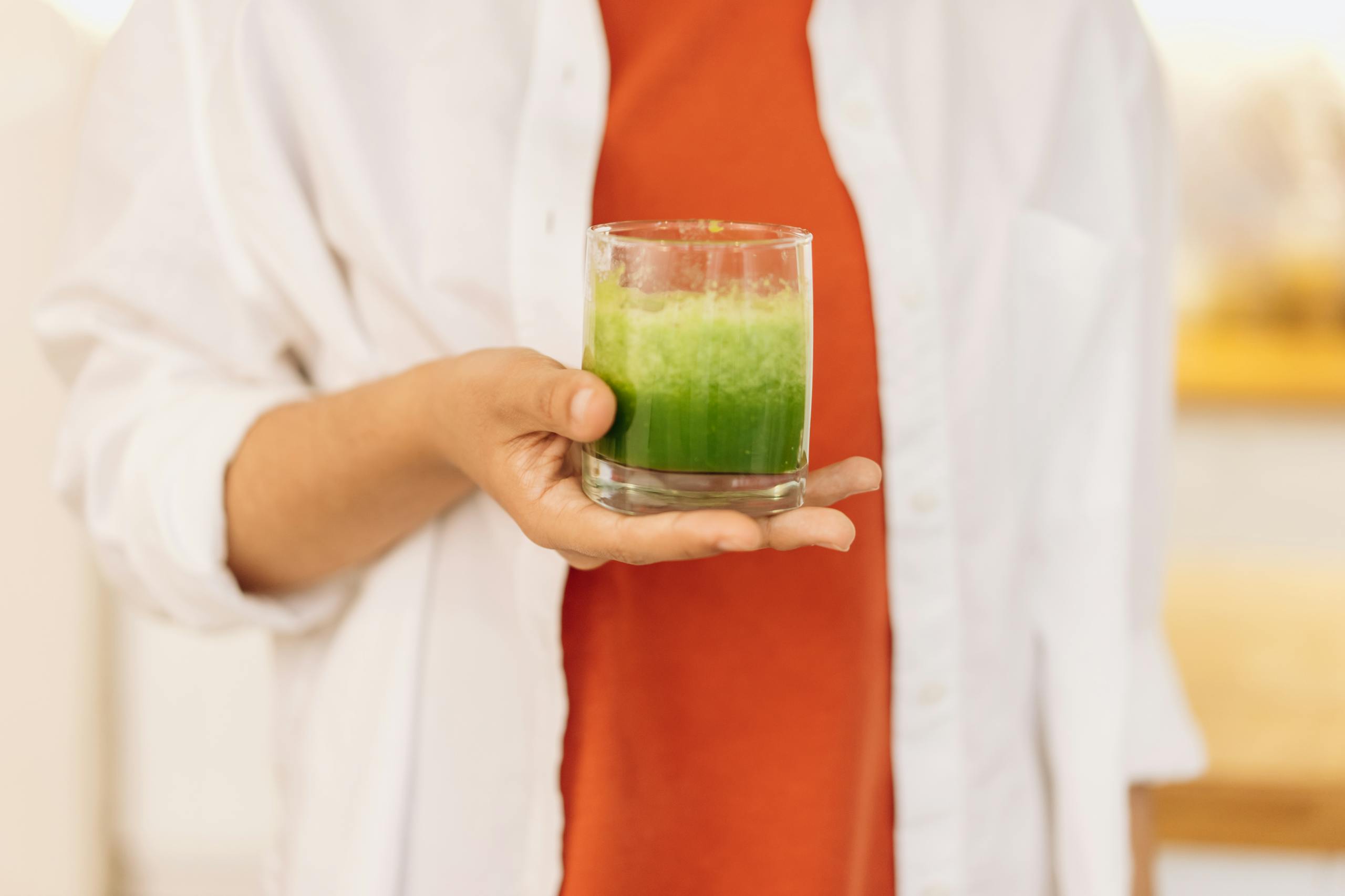 Person Holding Clear Drinking Glass Of Fresh Smoothie